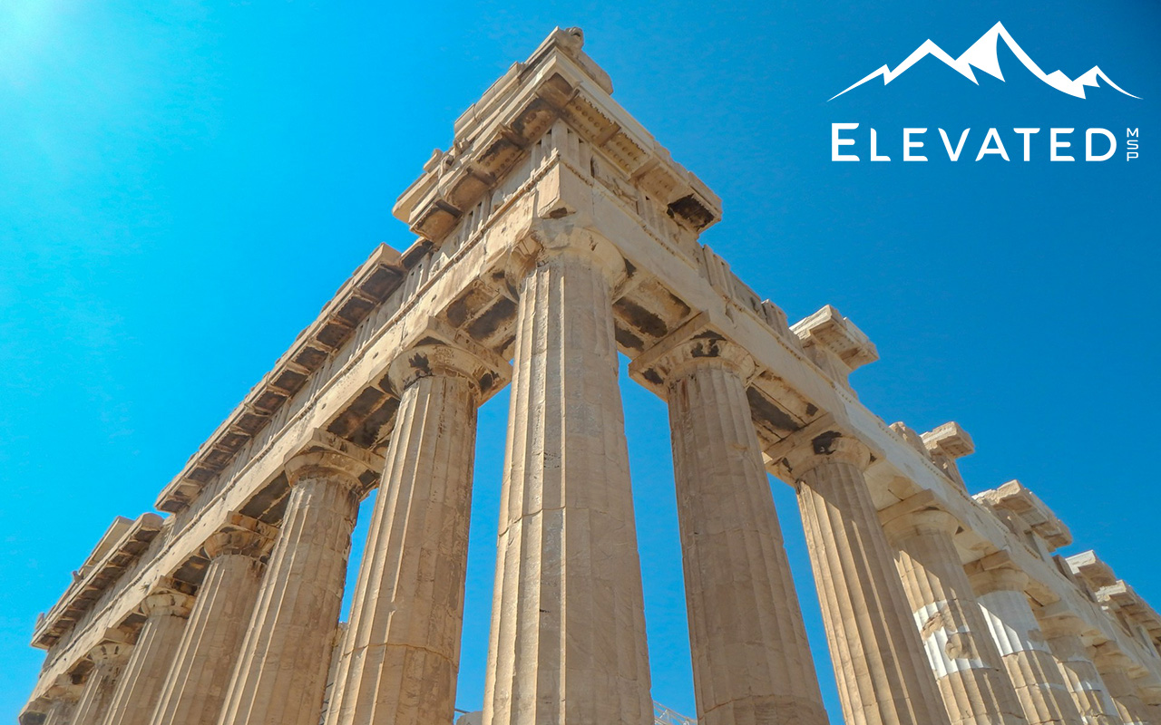 Photo of the Parthenon in Greece against a bright blue sky.